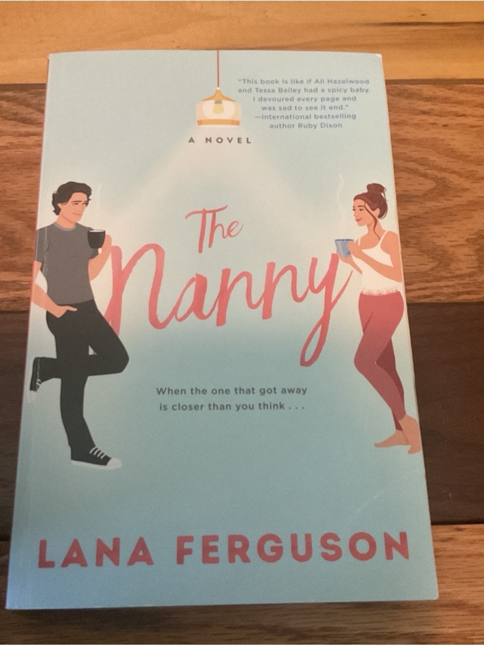 The Nanny by Lana Ferguson - Light Blue & Pink Paperback Novel